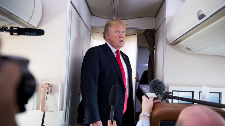 US President Donald Trump speaks to the press aboard Air Force One in flight as he travels from Joint Base Andrews in Maryland, to Bedminster, New Jersey, June 29, 2018. (Photo by SAUL LOEB / AFP)        (Photo credit should read SAUL LOEB/AFP/Getty Images)