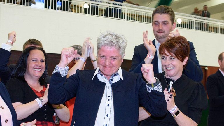 The DUP&#39;s first openly gay candidate, Alison Bennington, celebrates after winning a seat at Antrim and Newtownabbey Borough Council.