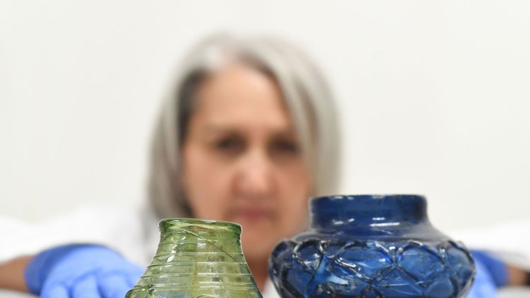 Blue and green glass beakers were found whole in the site
