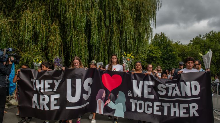 People march to remember the victims of the Christchurch mosque shootings