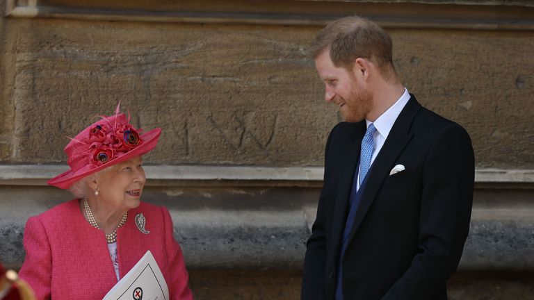 Queen Elizabeth II talks to the Duke of Sussex as they leave after the wedding of Lady Gabriella Windsor 