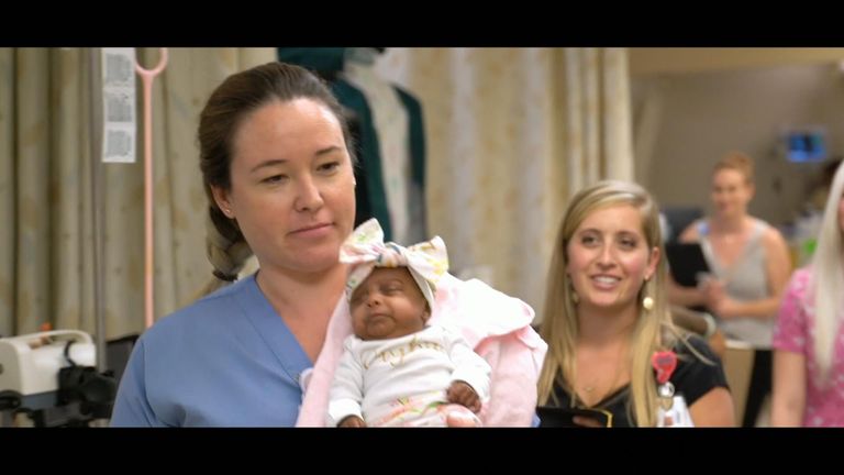Nurse Emma Wiest with the baby. Pic: Sharp Mary Birch Hospital