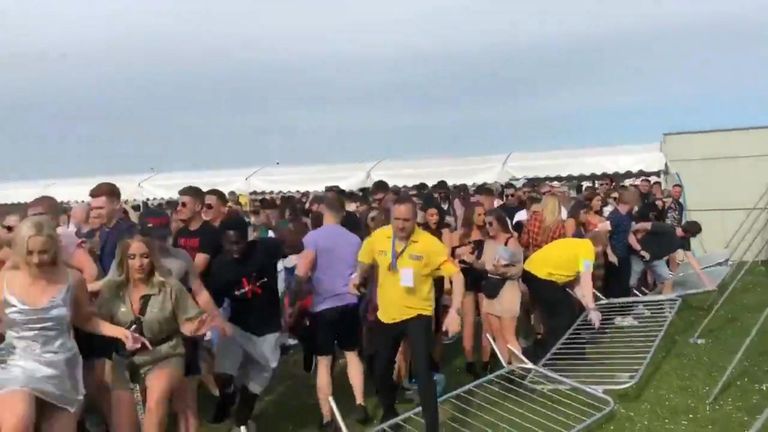 Long queues prompted crowds to push through security barriers at a festival in London