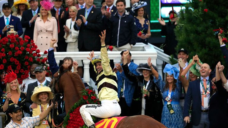 Jockey Flavien Prat celebrates after winning the race