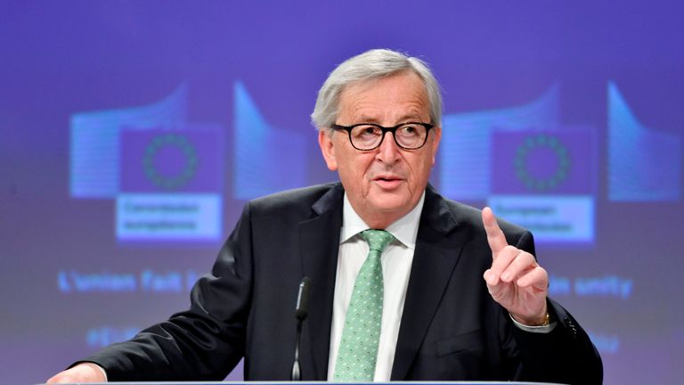 European Commission President Jean-Claude Juncker gestures as he speaks during a press conference