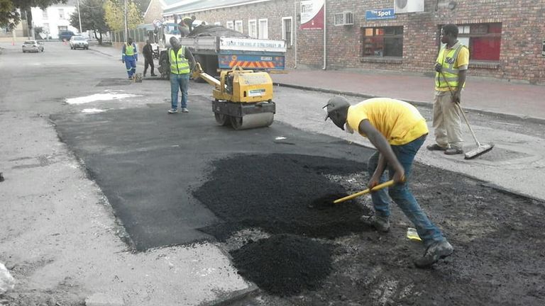 The team repair a potholed road in Makhana