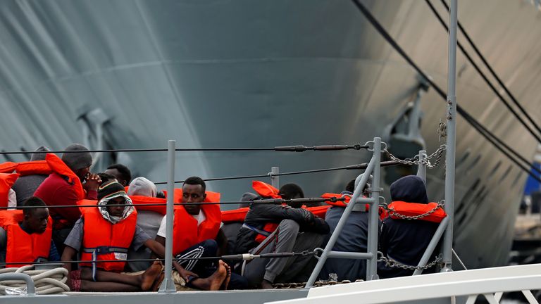 The migrants sit on a patrol boat of the Armed Forces of Malta before disembarking at their base at the port of Marsamxett, Valletta, Malta May 25, 2019. REUTERS / Darrin Zammit Lupi