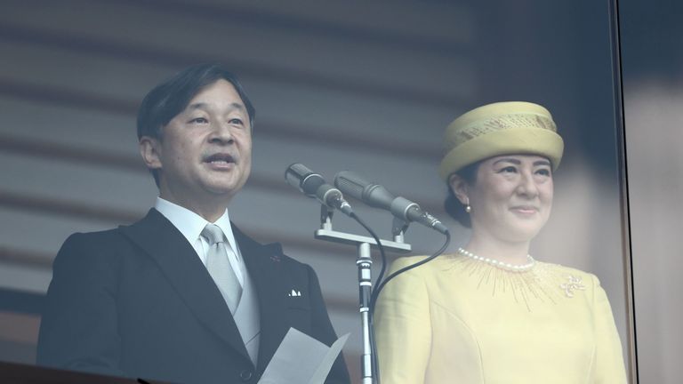 Japan's Emperor Naruhito (L) reads a statement as he and Empress Masako (R) make their first public appearance after ascending to the throne, at the Imperial Palace in Tokyo on May 4, 2019