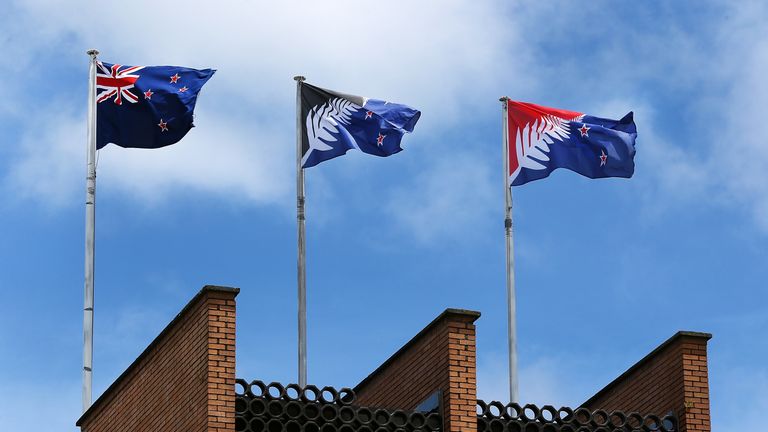 AUCKLAND, NEW ZEALAND - DECEMBER 14: The current New Zealand flag (L) the referendum winning blue and black Kyle Lockwood designed flag (C) and the second placed red and blue flag (R) fly on a building in New Lynn, Auckland on December 14, 2015 in Auckland, New Zealand. New Zealanders voted on December 12 for a possible replacement to their current flag. (Photo by Fiona Goodall/Getty Images)
