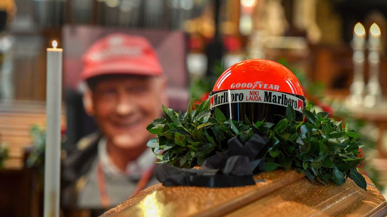 The helmet of the former Formula One driver Niki Lauda sits on top of his coffin