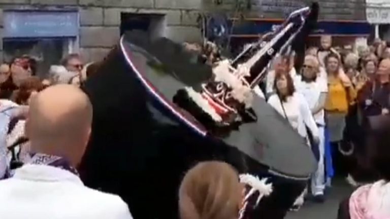 A woman has died after suffering a neck injury during the traditional May Day Obby Oss celebration in Padstow, Cornwall.