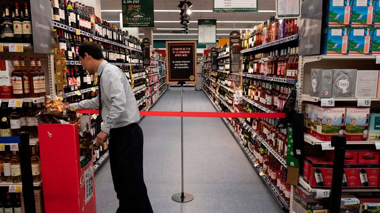 The director of the Casino supermarket on Garibaldi avenue in Lyon, Robert How Son Chong, closes alcohol section on March 15, 2019, as opening hours are 24 hours a day and 7 days a week and a Prefect&#39;s decree forbids the sale of alcohol from 9.30 pm to 8.30 am