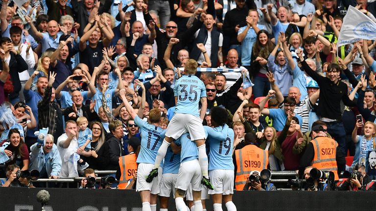 Raheem Sterling celebrates with teammates after the fifth goal