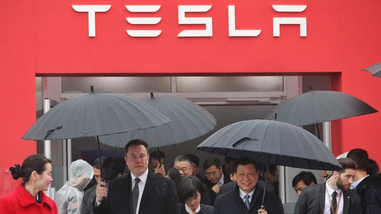 Tesla boss Elon Musk (L) walks with Shanghai Mayor Ying Yong during the ground-breaking ceremony for a Tesla factory in Shanghai on January 7, 2019. - Musk presided over the ground-breaking for a Shanghai factory that will allow the electric-car manufacturer to dodge the China-US tariff crossfire and sell directly to the world's biggest market for 