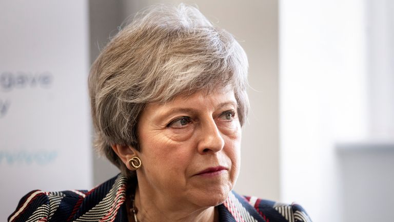 British Prime Minister Theresa May talks with a case worker and domestic violence survivor at Advance Charity offices in West London, where she discussed support for victims of domestic violence, in Britain May 13, 2019. Victoria Jones/Pool via REUTERS
