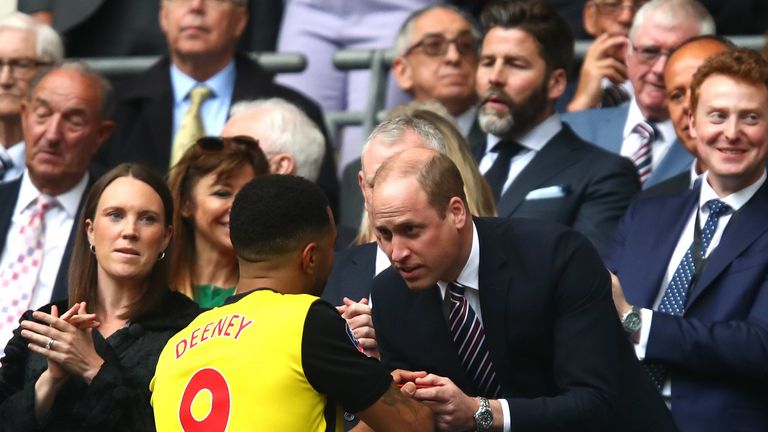 Prince William, Duke of Cambridge talks to Troy Deeney of Watford after their loss