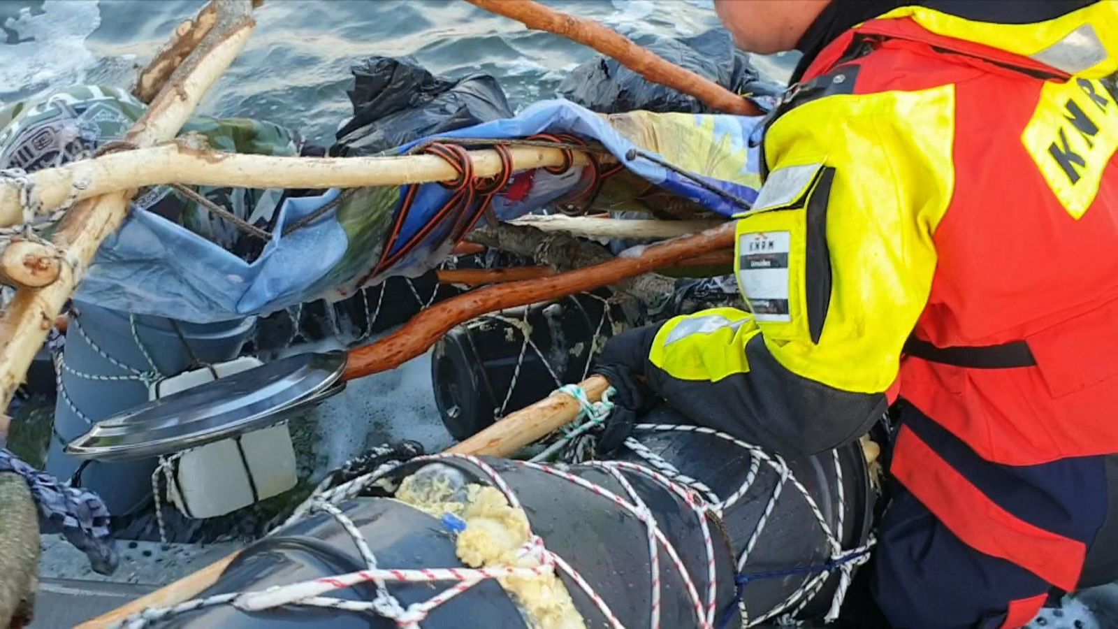 Wooden Raft Rescued Ramshackle raft pulled aboard rescue boat | News UK Video News | Sky News