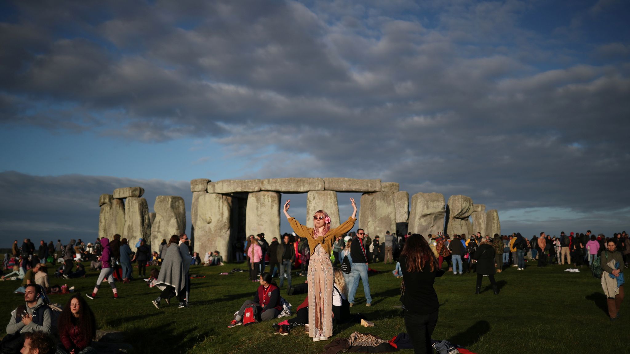 The sun rises as revellers welcome in the Summer Solstice at the Stonehenge...