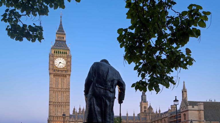 "Houses Of Parliament behind the statue of Winston Churchill, London, UK."