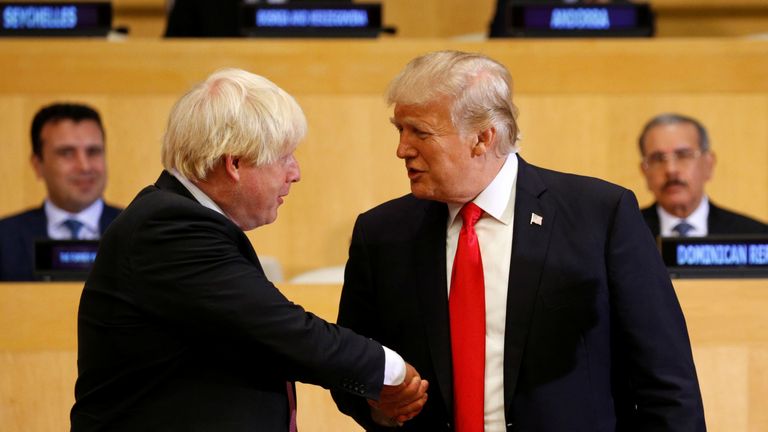 U.S. President Donald Trump shakes hands with British Foreign Secretary Boris Johnson (L) as they take part in a session on reforming the United Nations at U.N. Headquarters in New York, U.S., September 18, 2017. REUTERS/Kevin Lamarque