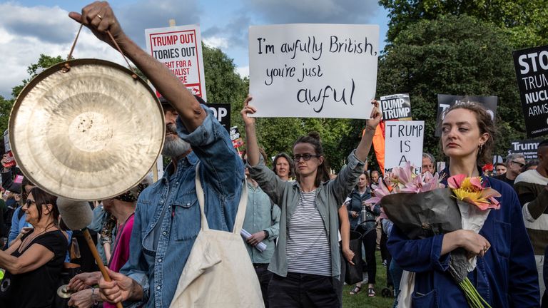 LONDON, ENGLAND - JUNE 03: People hold placards in protest over Donald Trump's state visit outside Buckingham Palace on the first day of the U.S. President and First Lady's three-day State visit on June 3, 2019 in London, England. President Trump's three-day state visit will include lunch with the Queen, and a State Banquet at Buckingham Palace, as well as business meetings with the Prime Minister and the Duke of York, before travelling to Portsmouth to mark the 75th anniversary of the D-Day landings.(Photo by Dan Kitwood/Getty Images)