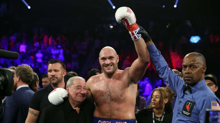 LAS VEGAS, NEVADA - JUNE 15:  Tyson Fury (C) poses with boxing promoter Bob Arum (L) and referee Kenny Bayless after defeating Tom Schwarz during a heavyweight fight at MGM Grand Garden Arena on June 15, 2019 in Las Vegas, Nevada. Fury won with a second-round TKO.  (Photo by Steve Marcus/Getty Images)