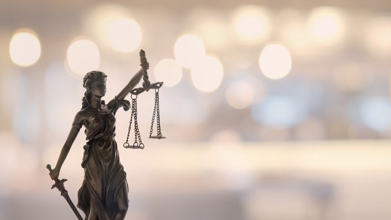 Justice law legal concept. statue of justice or lady justice with bokeh background.