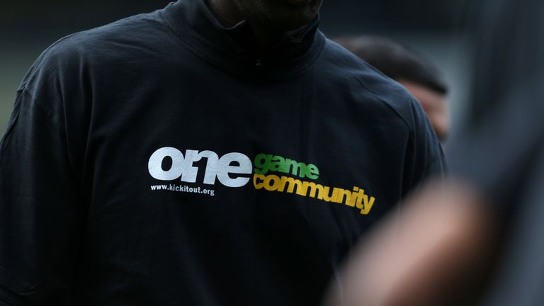 A view of a Kick It Out anti-racism t-shirt worn by a player during pre-match training