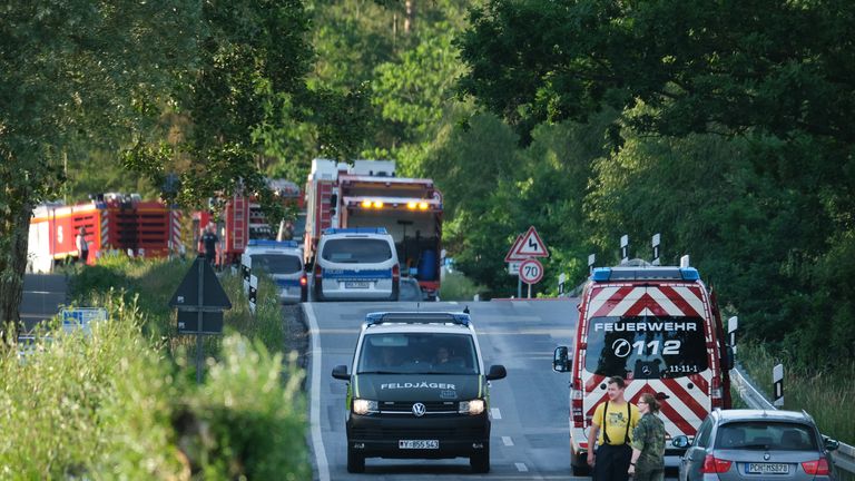 NOSSENTIN, GERMANY - JUNE 24: Emergency crews and vehicles stand near the crash site of one of two Bundeswehr Eurofighter fighter jets on June 24, 2019 near Nossentin, Germany. Two Eurofighters collided during training earlier today, leaving one pilot dead. (Photo by Sean Gallup/Getty Images)