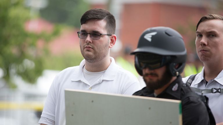 James Alex Fields Jr., (L) is seen attending the "Unite the Right" rally in Emancipation Park before being arrested by police and charged with charged with one count of second degree murder, three counts of malicious wounding and one count of failing to stop at an accident that resulted in a death after police say he drove a car into a crowd of counter-protesters later in the afternoon in Charlottesville, Virginia, U.S., August 12, 2017. Picture taken August 12, 2017  REUTERS/Eze Amos