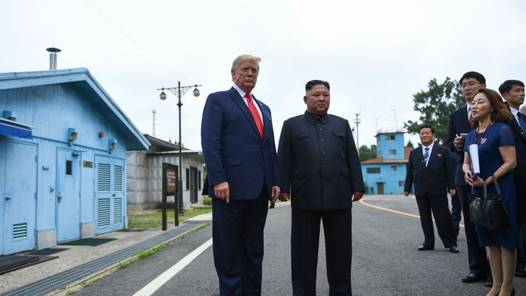 North Korea's leader Kim Jong Un stands with US President Donald Trump south of the Military Demarcation Line that divides North and South Korea, in the Joint Security Area (JSA) of Panmunjom in the Demilitarized zone (DMZ) on June 30, 2019. (Photo by Brendan Smialowski / AFP)        (Photo credit should read BRENDAN SMIALOWSKI/AFP/Getty Images)