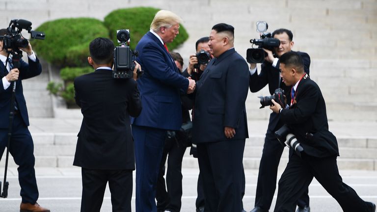 North Korea's leader Kim Jong Un shakes hands with US President Donald Trump north of the Military Demarcation Line that divides North and South Korea, in the Joint Security Area (JSA) of Panmunjom in the Demilitarized zone (DMZ) on June 30, 2019. (Photo by Brendan Smialowski / AFP)        (Photo credit should read BRENDAN SMIALOWSKI/AFP/Getty Images)