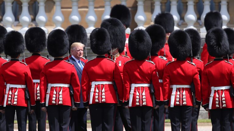 US President Donald Trump inspects an honour guard at Buckingham Palace