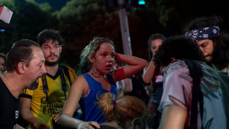 A child receives treatment from demonstrators after been injured during clashes