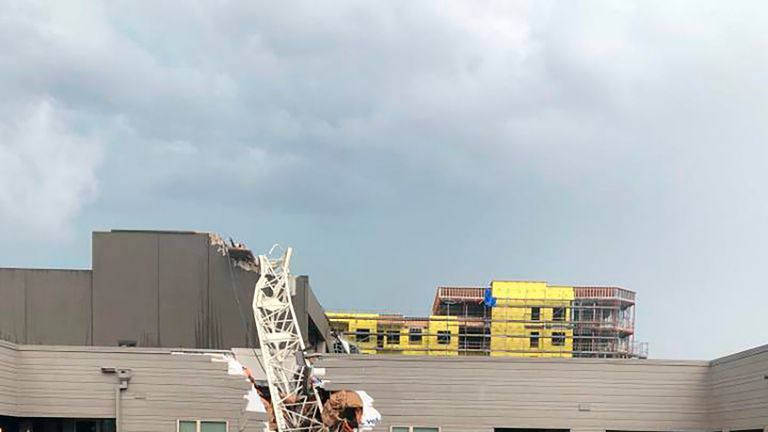 This photo provided by Michael Santana shows the scene after a crane collapsed into Elan City Lights apartments in Dallas amid severe thunderstorms Sunday, June 9, 2019. (Michael Santana via AP)