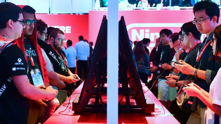 Gaming fans play Super Smash Bros on Nintendo Switch at the 24th Electronic Expo, or E3 2018, in Los Angeles, California on June 13, 2018 where hardware manufacturers, software developers and the video game industry present their new games at the 3-day event between June 12-14. (Photo by Frederic J. BROWN / AFP) (Photo credit should read FREDERIC J. BROWN/AFP/Getty Images)
