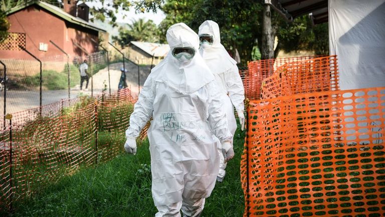 Medical staff dress in protective clothing for a weekly rehearsal in Uganda in December 2018