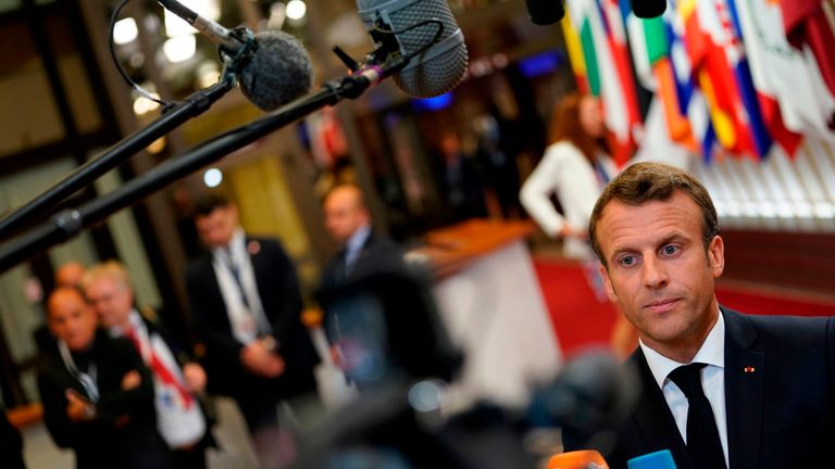 French President Emmanuel Macron speaks to the press as he leaves after a European Union (EU) summit at the EU Headquarters in Brussels on June 21, 2019 on the first day of a summit of EU leaders