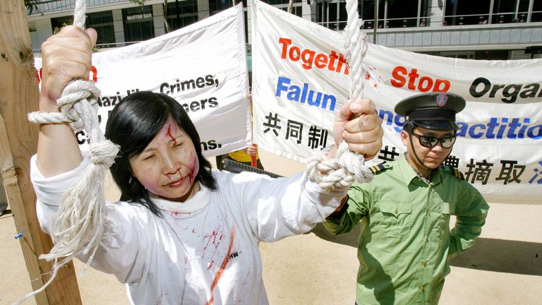 Falun Gong participate in street theatre in a protest over the Chinese government harvesting body organs from arrested Falun Gong practitioners in China as the world&#39;s biggest finance conference, the G20 summit, prepares to start, in Melbourne 17 November 2006