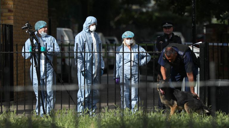 Police and forensics officers at the scene in Tower Hamlets