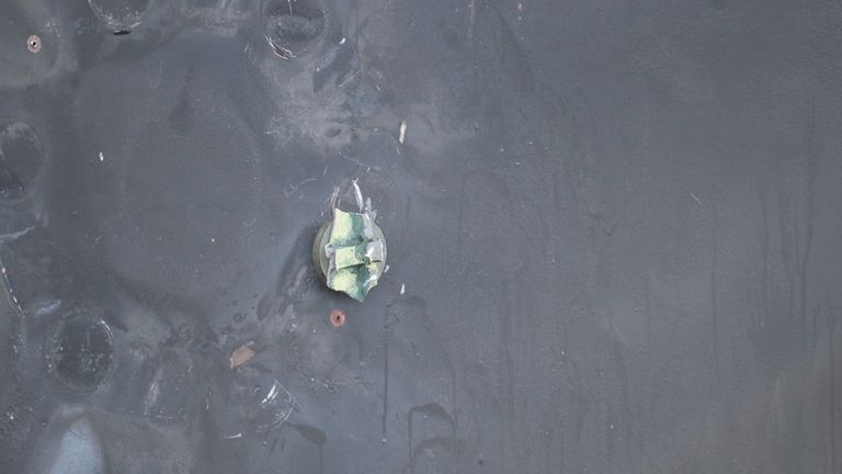 Aluminum and green composite material the US says was left behind following the removal of an unexploded limpet mine on the Japanese owned motor tanker Kokuka Courageous in the Gulf of Oman