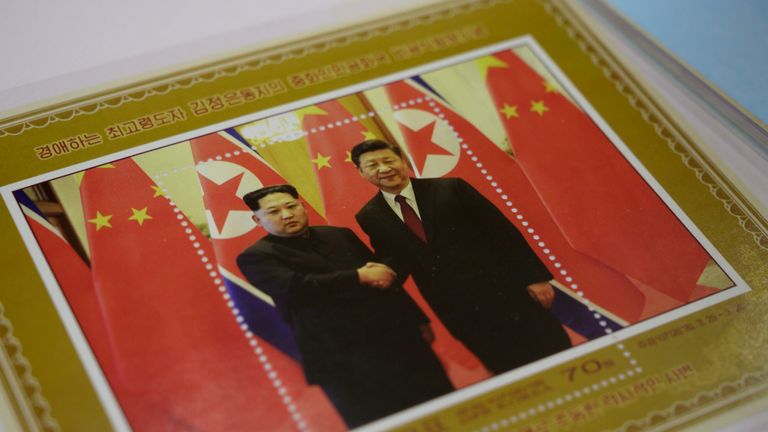 A commemorative stamp featuring North Korean leader Kim Jong-Un (L) meeting with China's leader Xi Jinping is pictured at a shop in Pyongyang on June 18, 2019