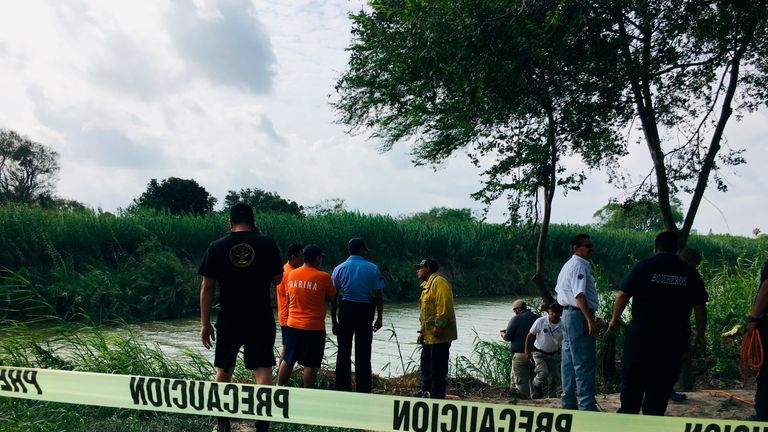 Authorities at the Rio Grande bank where the bodies of Salvadoran migrant Oscar Alberto Martínez Ramírez and his nearly 2-year-old daughter Valeria were found, in Matamoros, Mexico