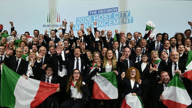 Members of the delegation of Milan/Cortina d&#39;Ampezzo  celebrate 