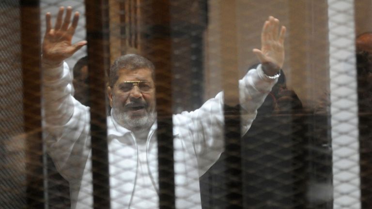 Mr Morsi collapsed inside the glass defendants cage at Cairo&#39;s Tura Prison