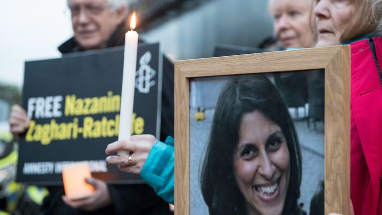 Supporters hold a photo of Nazanin Zaghari-Ratcliffe