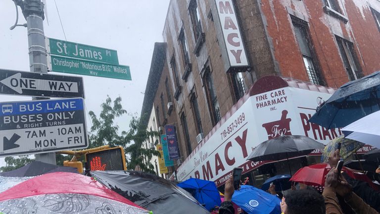 Fans take photos at the unveiling of the new Christopher "Notorious B.I.G" Wallace way in the Brooklyn borough of New York, U.S., June 10, 2019. REUTERS/Shannon Stapleton