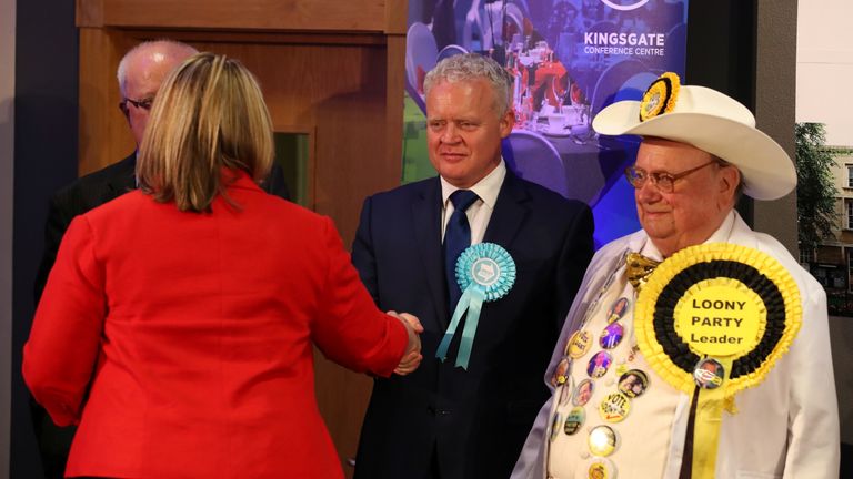 Brexit Party candidate Mike Greene shakes hands with Labour Party candidate Lisa Forbes after she won the Peterborough by-election