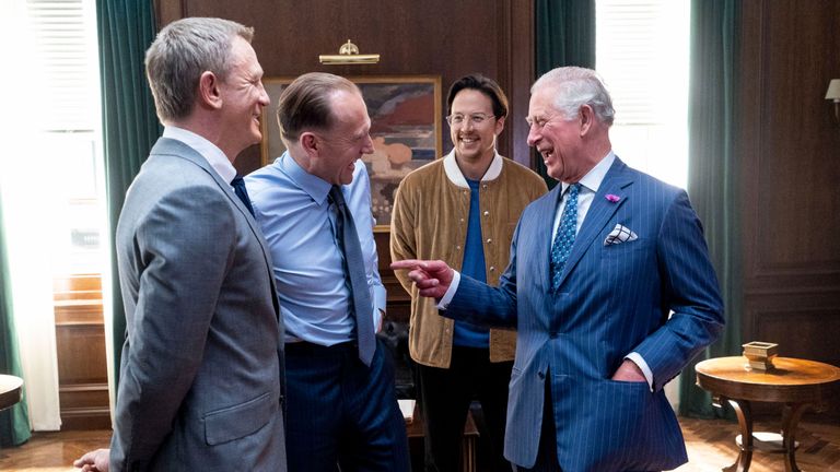 The Prince of Wales with (left to right) actors Daniel Craig, Ralph Fiennes and director Cary Joji Fukunaga during a visit to the set of the 25th James Bond film at Pinewood Studios in Iver Heath, Buckinghamshire. 