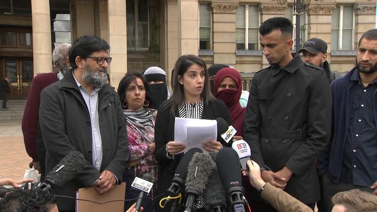 Parent Rosina Afsar talking to reporters 